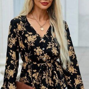 Black long-sleeve blouse with gold flowers